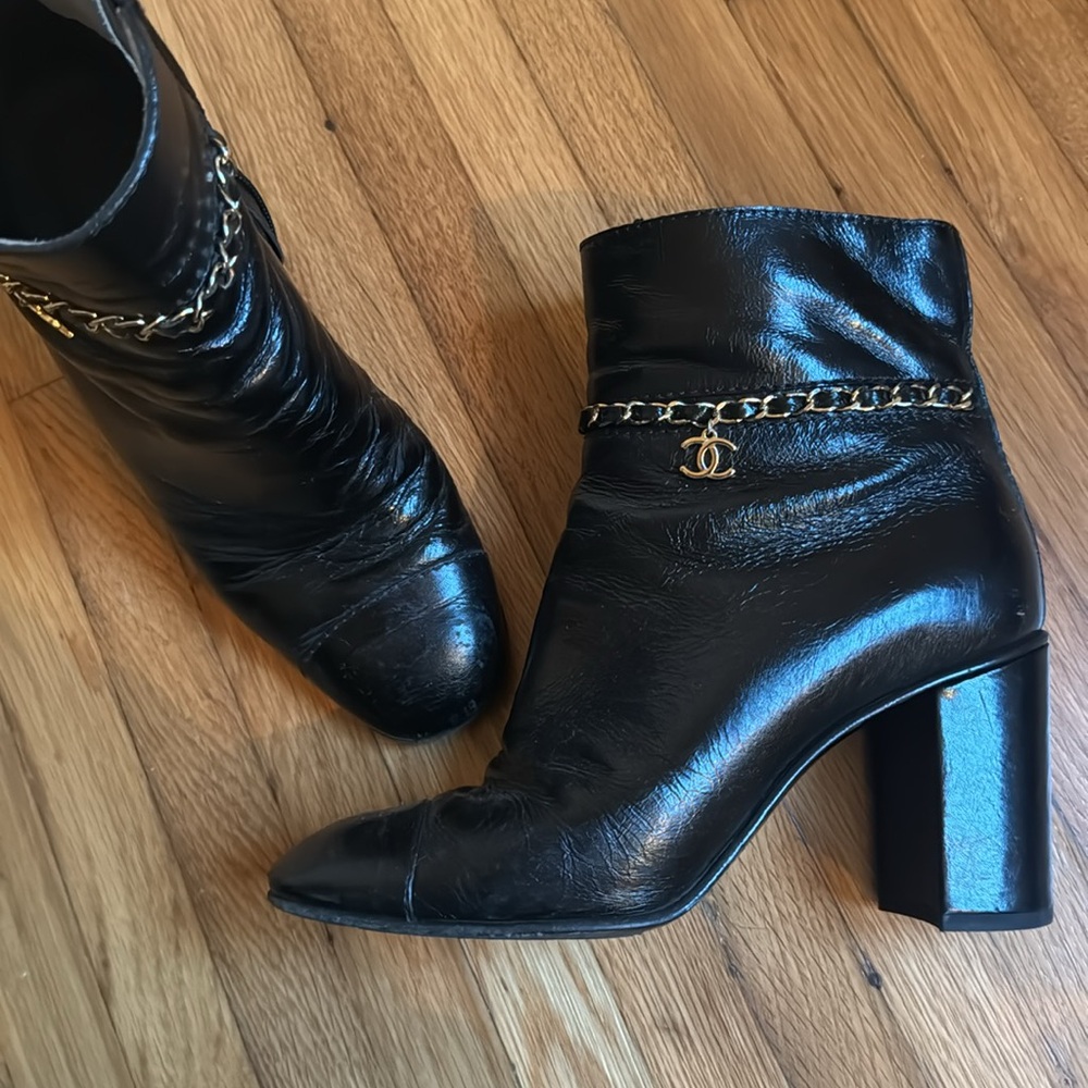 Chanel black leather ankle boot with chain